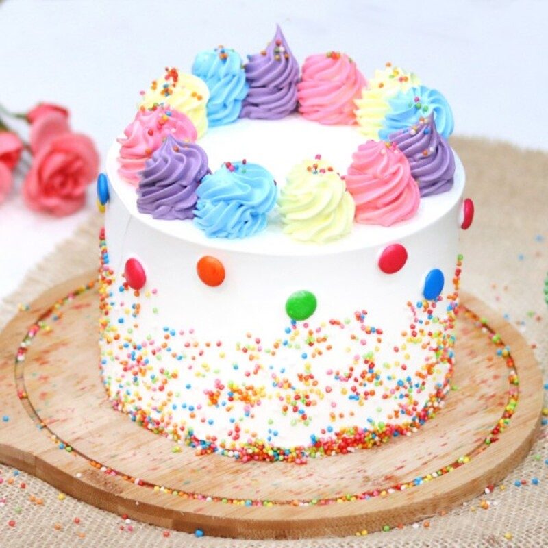 You'll Want to Dive Headfirst into This Rainbow Funfetti Ice Cream Cake -  Brit + Co